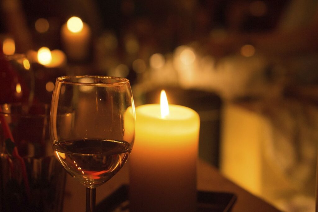 Glass of wine and candle