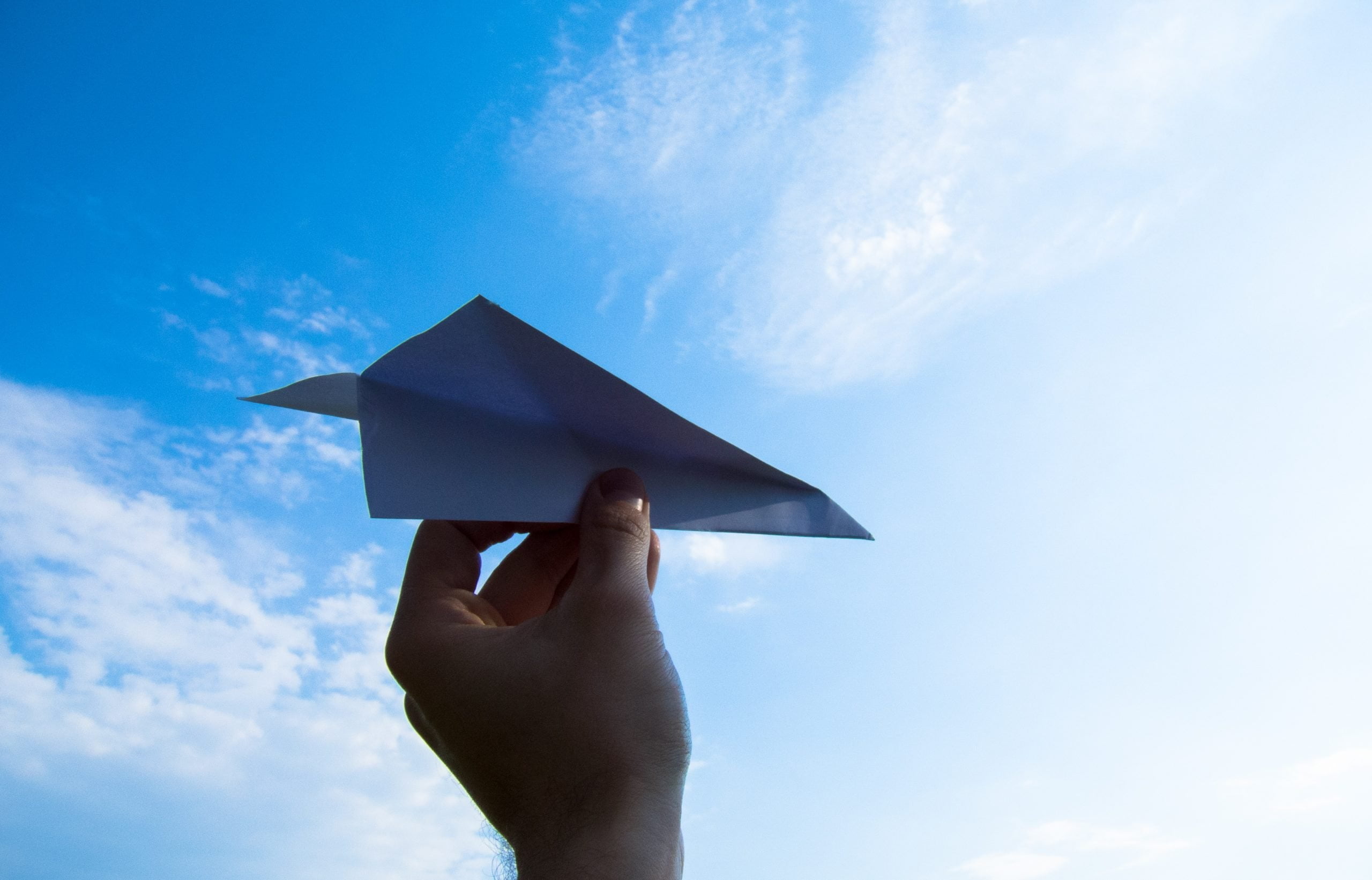 paper plane, the hand, sky