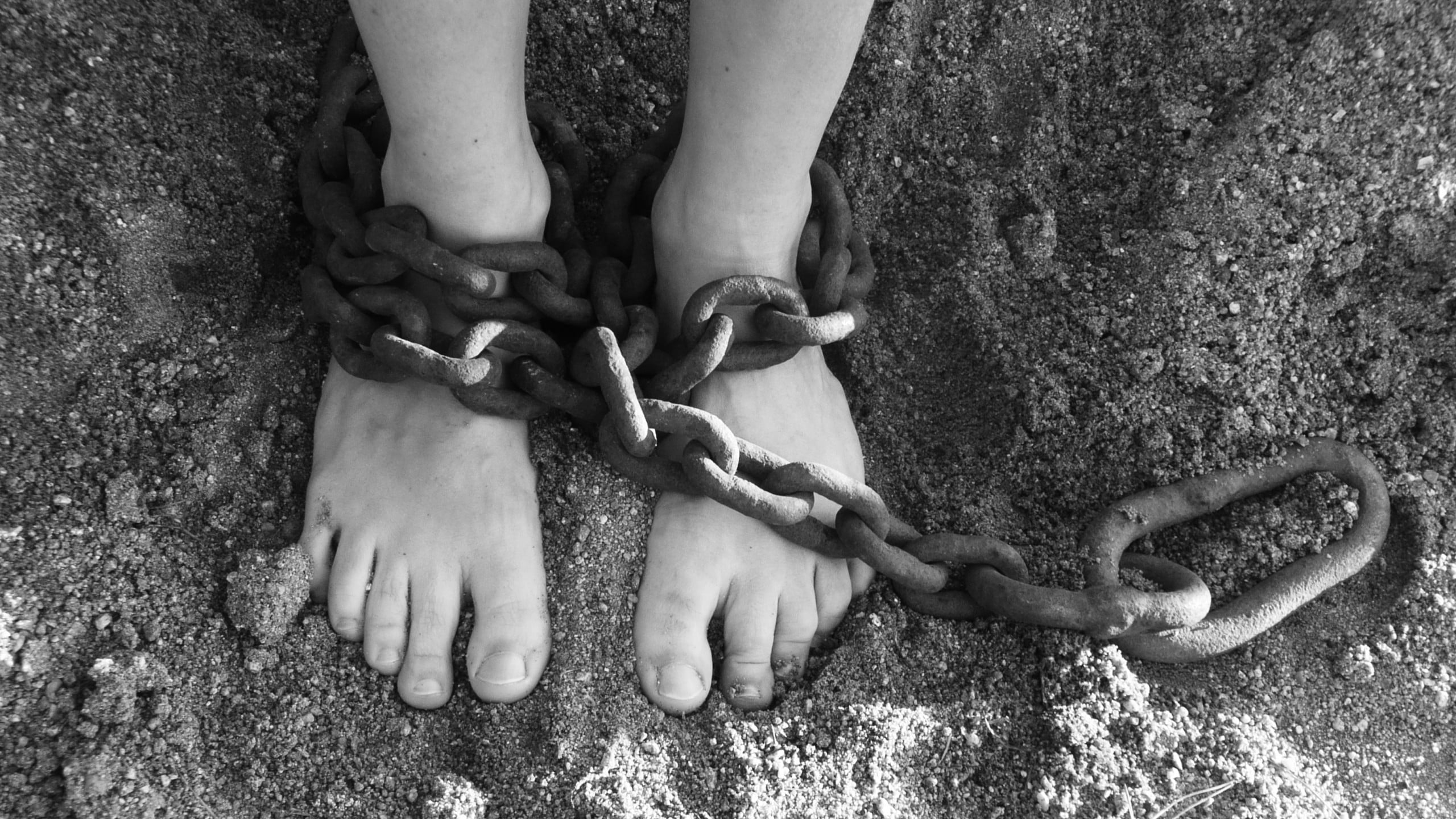 chains, feet, sand