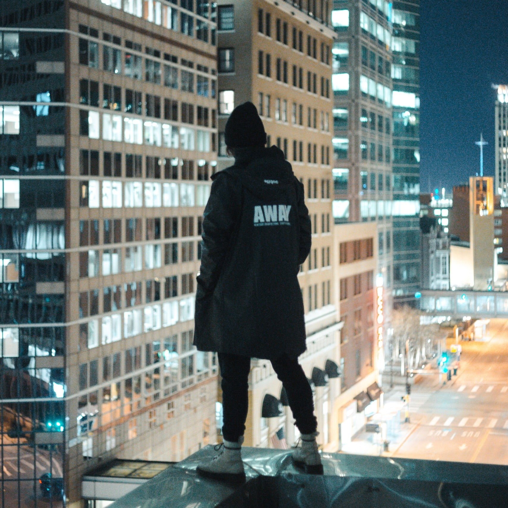 person standing on rooftop at night