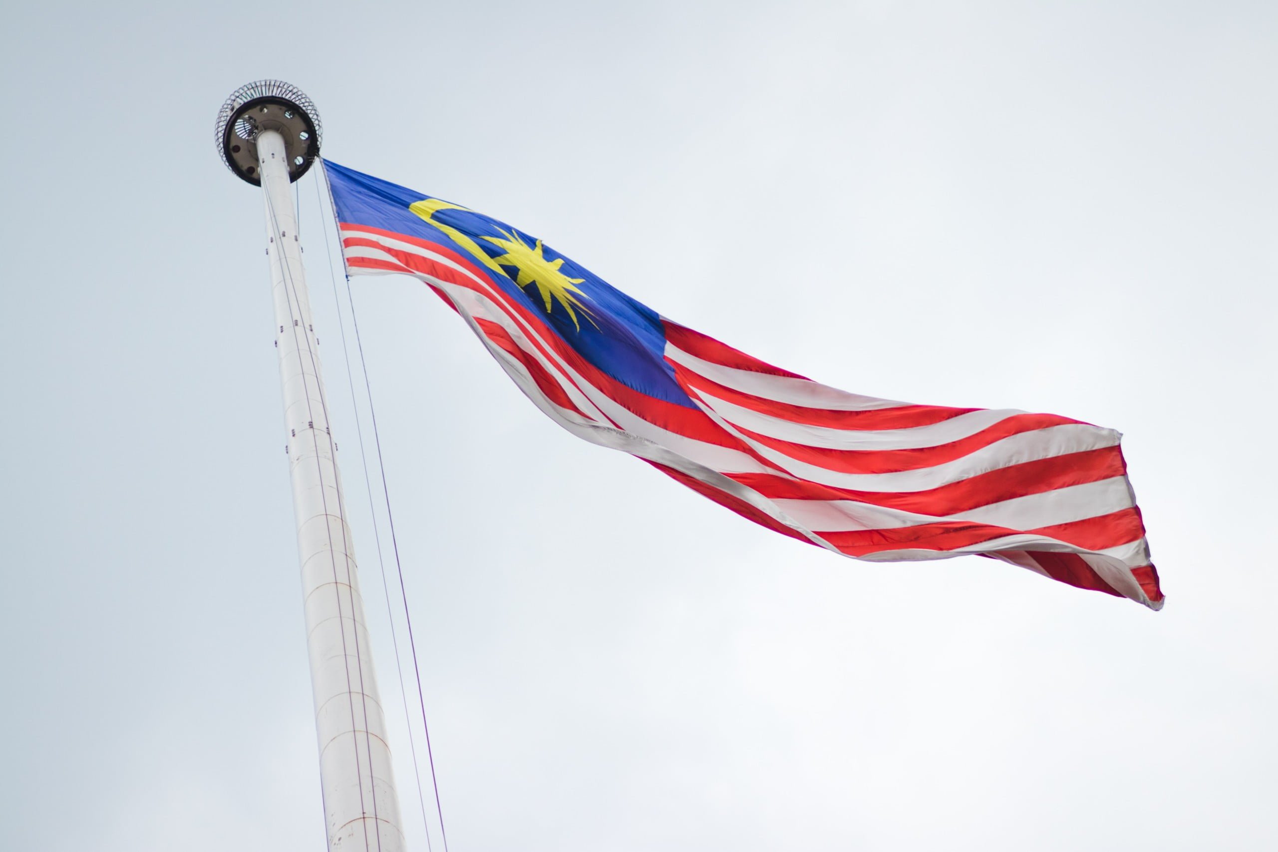 raised Malaysia flag during daytime