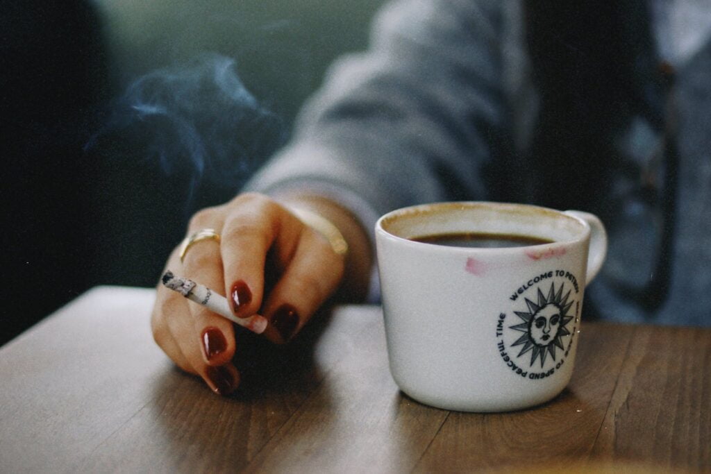 Cigarette in woman Hand